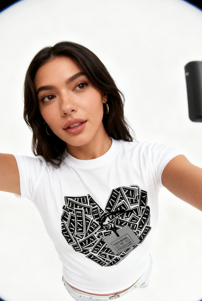 Woman wearing a white t-shirt with a black geometric design on a white background