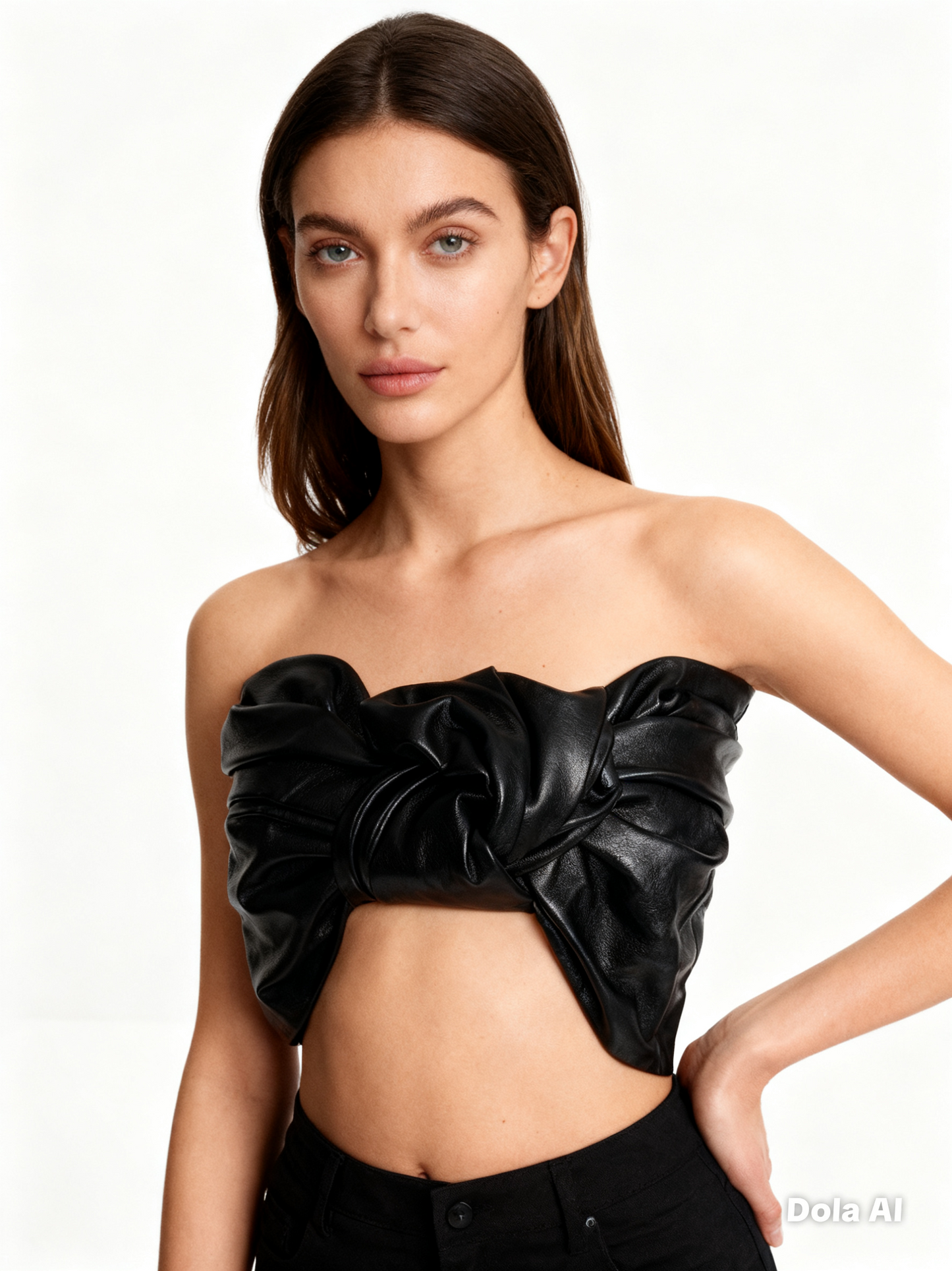 Woman wearing a black strapless top with ruched details on a white background